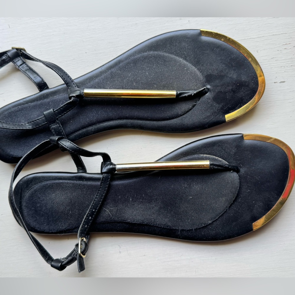 Black and Gold Sandals with Sleek Design and Flexible Sole
